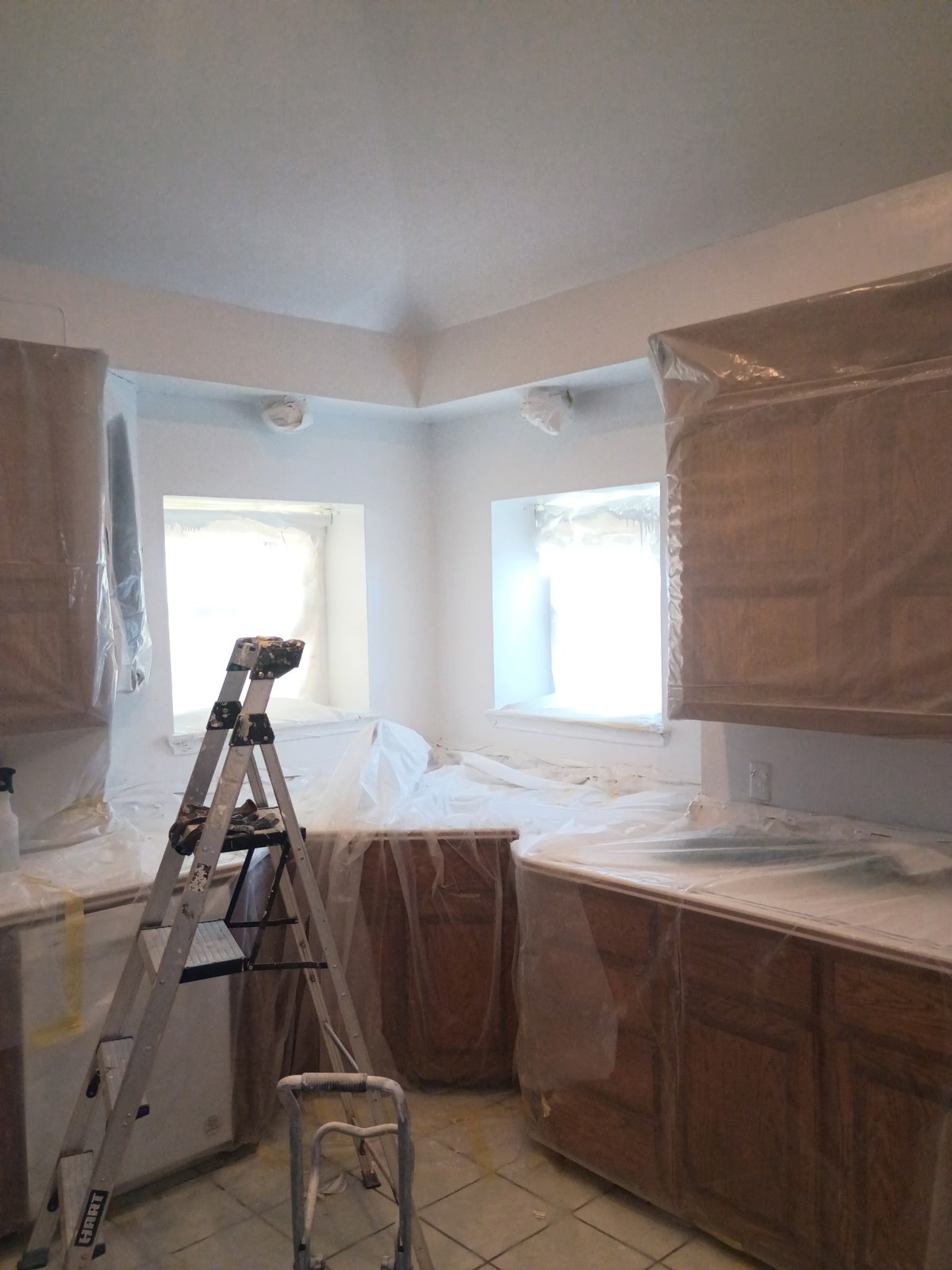 Protective coverings and preparation during kitchen work.